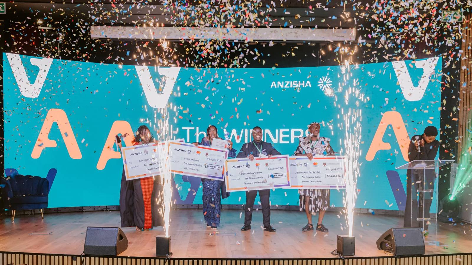 Award winners on stage with confetti and sparkular effects
