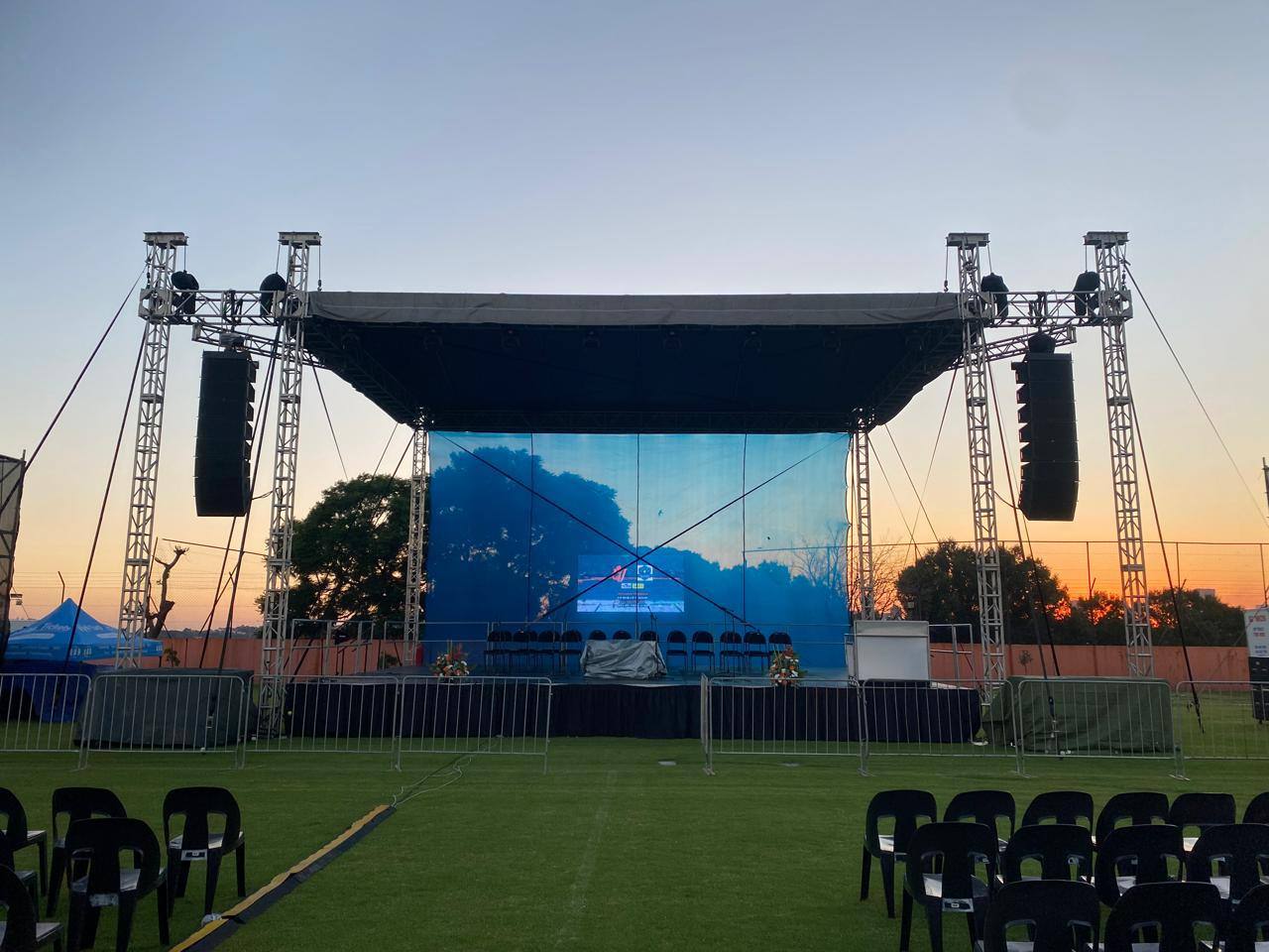 Outdoor main stage with line array sound at sunset